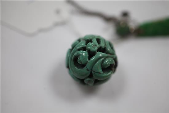 A Chinese turquoise bead, late 19th / early 20th century, 4.7cm